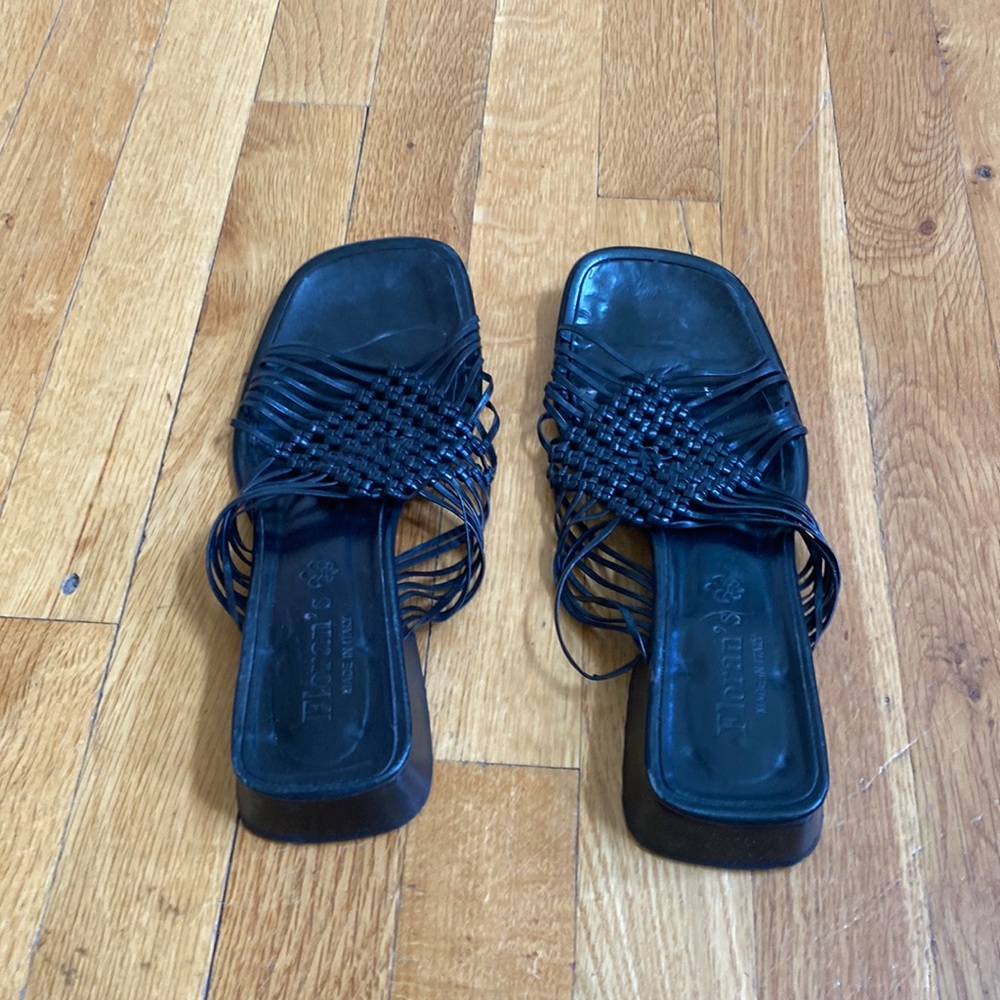 Black woven low heeled sandals